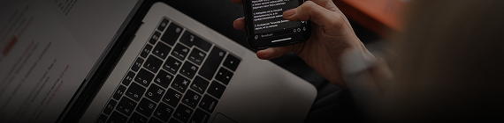 Close-up of hands using a laptop